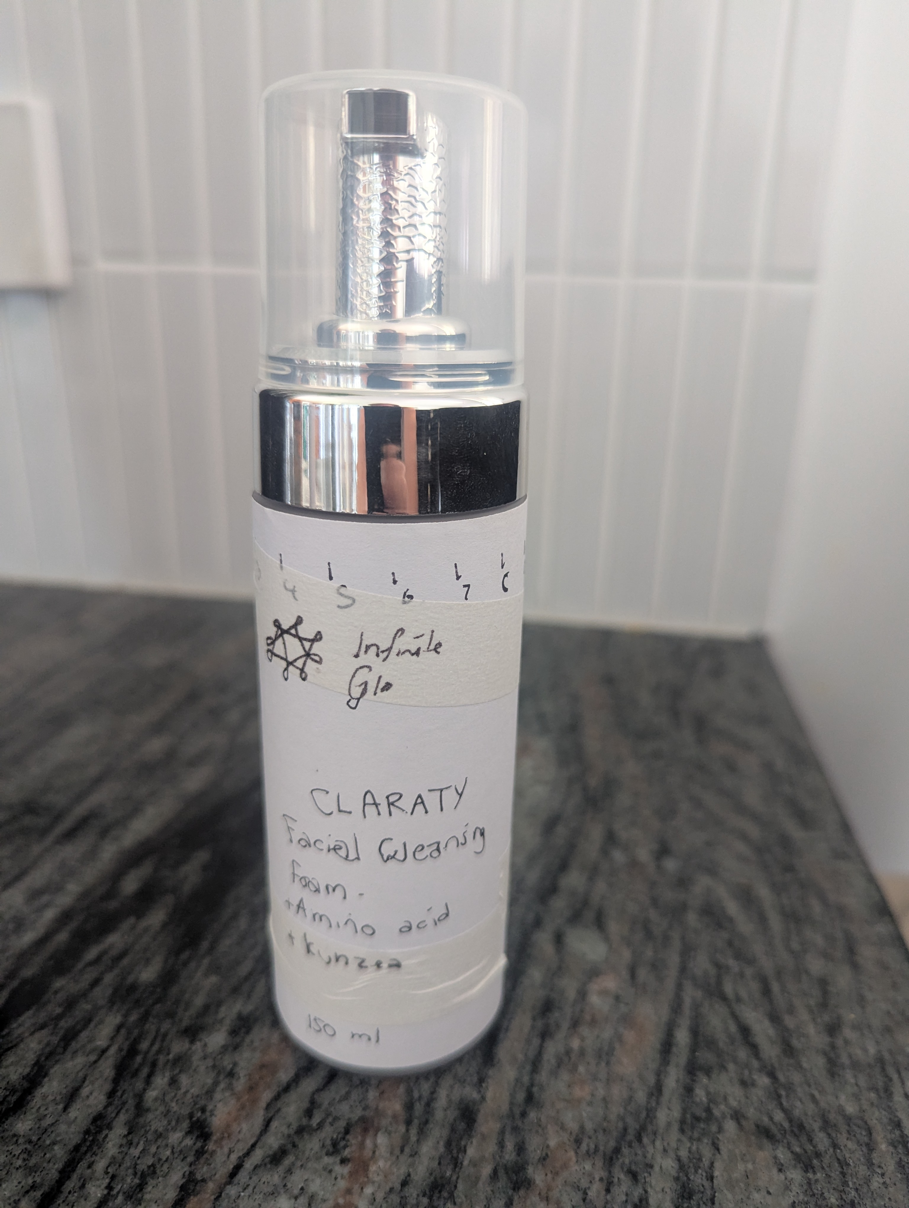 Infinite Glo Clarity Facial Cleansing Foam bottle